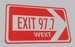 Exit 97.7 - WEXT Logo